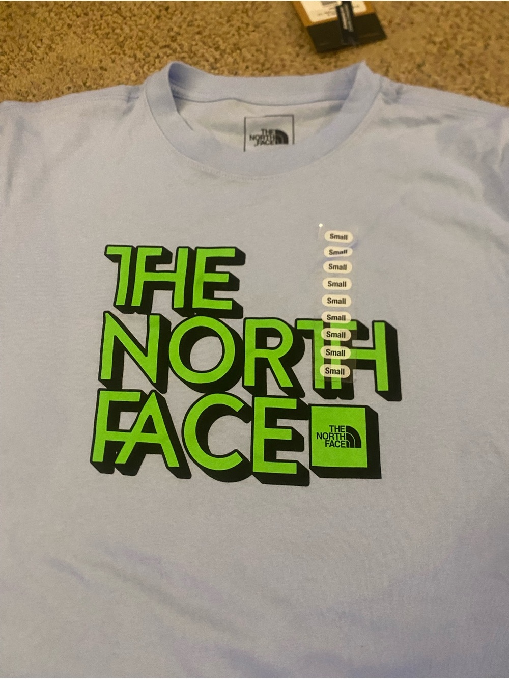 The North Face Men’s Short-Sleeve Tee in Light Blue with Neon Green Logo small